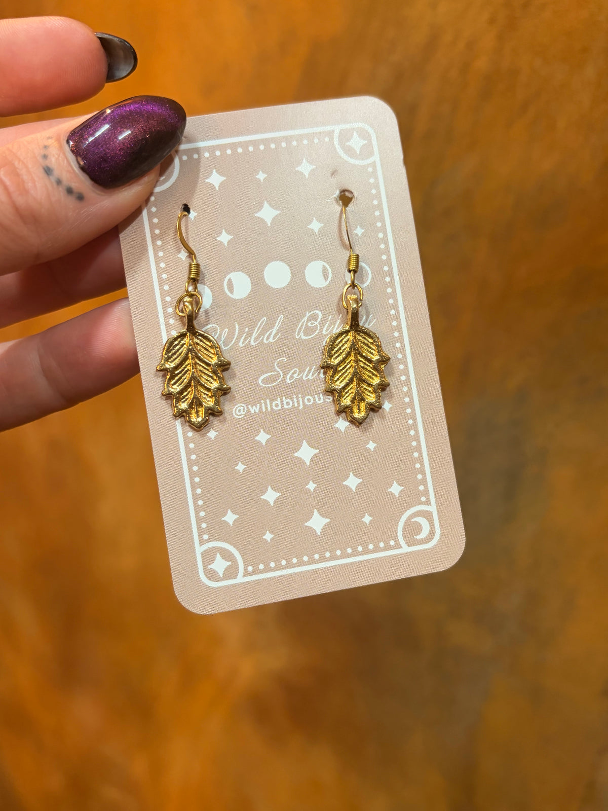 Golden feather earrings